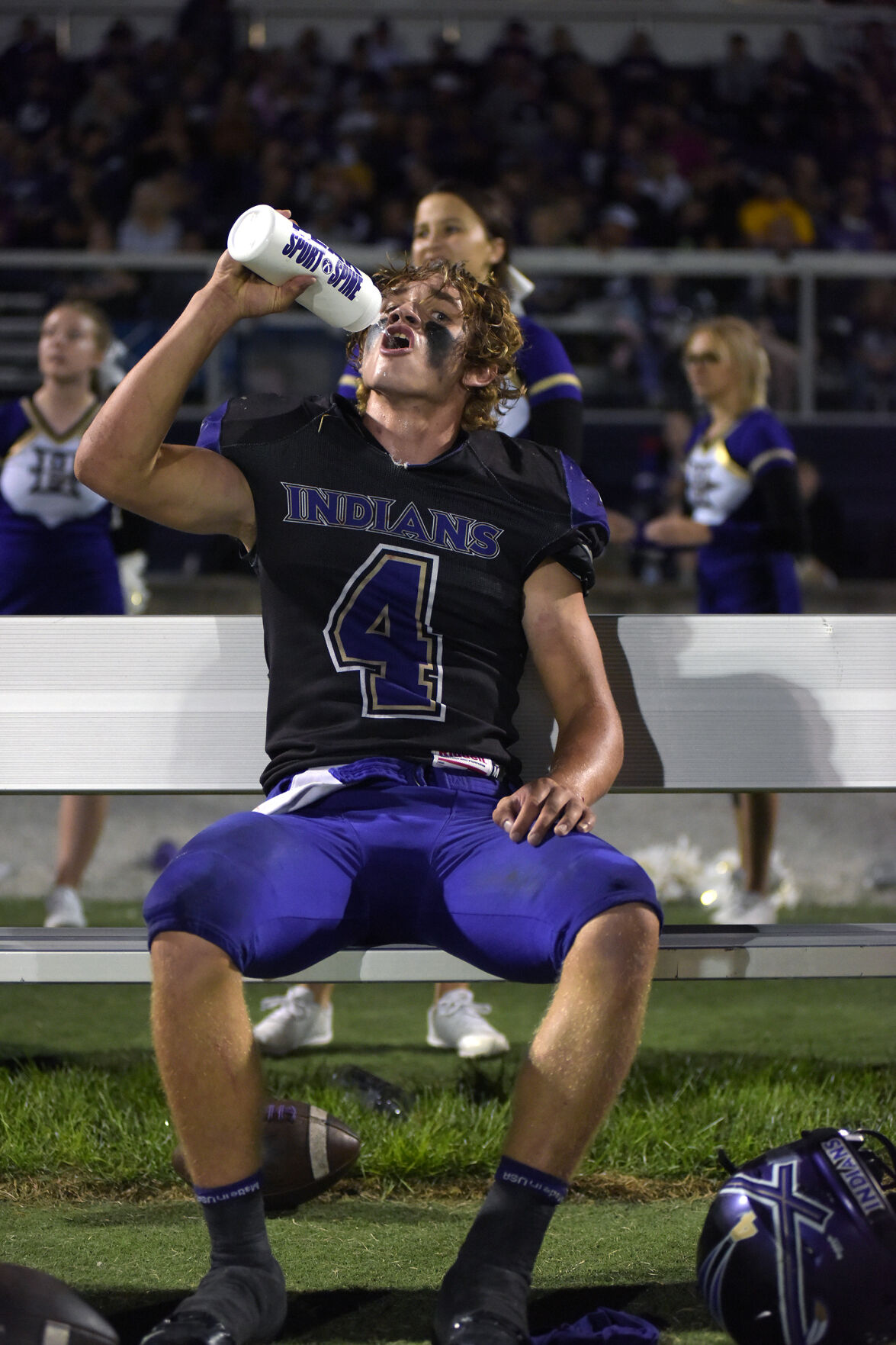 Hallsville quarterback Tyler Cobb takes a drink of water during Hallsville’s game against Blair Oaks high school on Friday